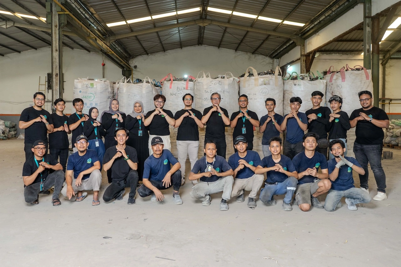 Hands sorting electronic waste